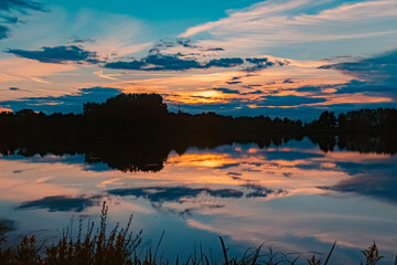 Beautiful sunset with reflections near Plattling, Isar, Bavaria, Germany