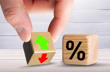 business man Hand change wood cube block with percentage to UP and Down arrow symbol icon concept