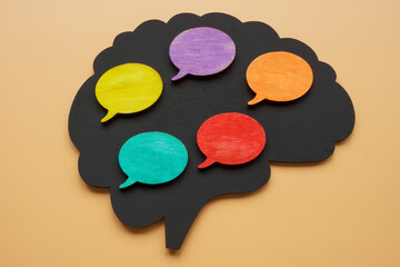 Multilingual concept. Brain shape and bubble quotes.