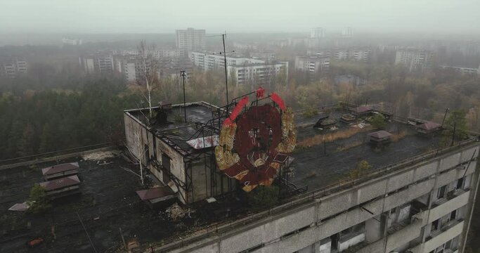 Aerial view over the sign of USSR on the roof in city of Pripyat near the Chernobyl nuclear power plant in Chernobyl exclusion zone. Ukraine. Ghost city after disaster