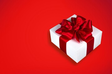 Beautiful giftbox with satin ribbon bow on the desk