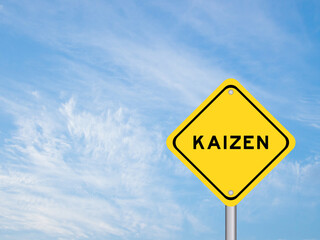 Yellow transportation sign with word kaizen on blue sky background