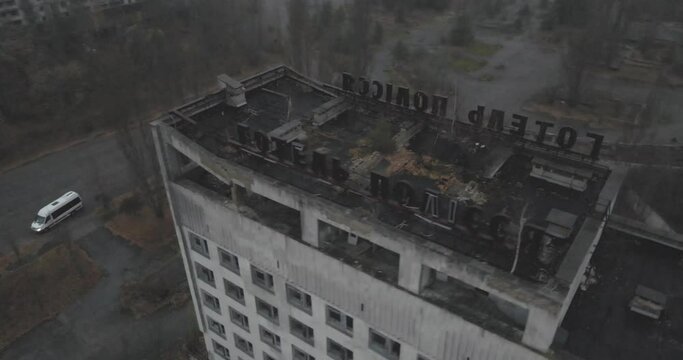 Aerial view of Abandoned Hotel Polissya of Pripyat near the Chernobyl nuclear power plant in Chernobyl exclusion zone. Ukraine. Ghost city after radioactive disaster