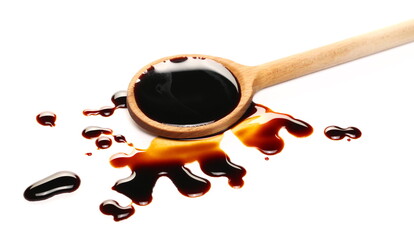 Soy sauce in wooden spoon isolated on white background