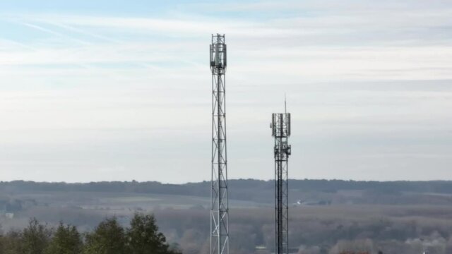 Aerial view of mobile network antennas in France countryside.