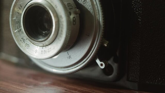 Old camera close-up. Antique photo equipment, macro shooting of vintage old-fashioned camera. 