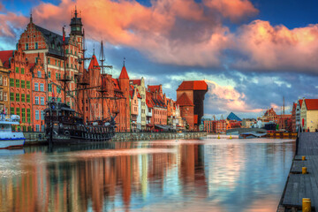 Fototapeta na wymiar Beautiful scenery of the old town in Gdansk over Motlawa river at sunrise, Poland.