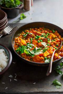 Vegeterian curry with chikpeas, peas, tomatoes, coriander and Indian Paneer cheese