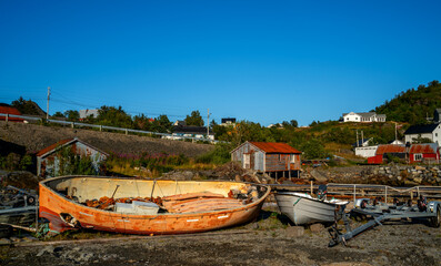 Landscape with wrecks of sloops in Norway
