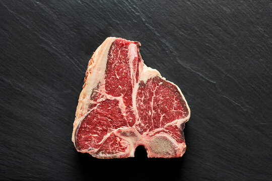 A t-bone steal on a black surface
