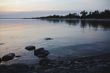 The sun setting over Sandbanks Provincial Park in Prince Edward County. The beaches and dunes...