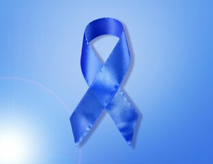 prostate cancer prevention campaign. Blue ribbon with bow on a light background.