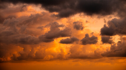 Beautiful evening sky with pink clouds. Sunset over the sea