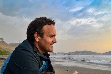 Fototapeta na wymiar Cheerful mature Caucasian man looking at the sea.