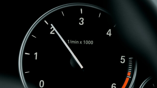 Instrument panel with tachometer, Close up image of illuminated car dashboard. Red arrow moving