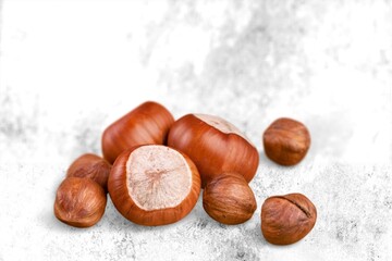 Hazelnuts on background is small round brown hard-shelled nut that is the edible fruit of hazel.