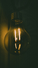 dusty  light bulb on black background