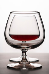 glasses for cognac on a white background. silhouette of glass goblet for alcohol