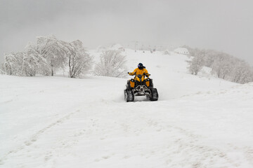 Snowmobile rider in the snow storm