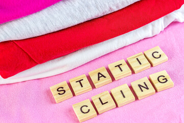 Bright dry stack of clothes with wooden words Static Cling.