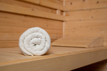 Traditional wooden sauna to relax. The high-quality service in a classic steam sauna. A towel for...