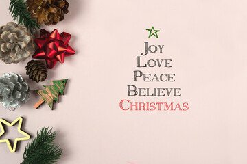 Christmas wishes in the form of a tree: joy,love,peace,believe.Christmas background with inspirational text on a conceptual image. Greeting card for happy holidays.