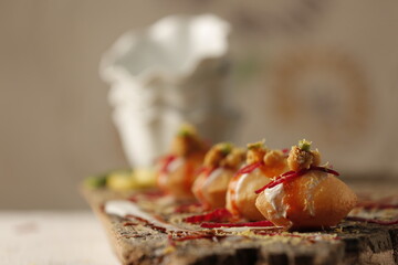 Spicy Pani Puri Golgappe with bowl, Chat item, North Indian street food, Indian panipuri snack, potato stuffing spicy Indian Street Food © AVdeziner