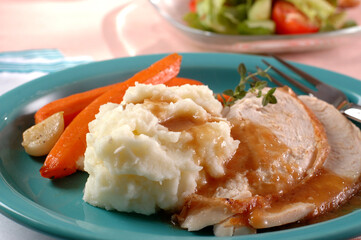 sliced turkey, mashed potatoes, carrots salad