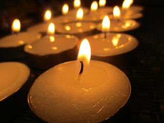  burning candle  in the dark