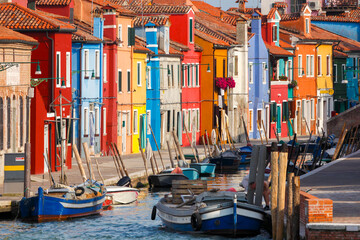Fototapeta na wymiar Colored Houses on the Waterfront on the Island of Burano; Venice, Italy