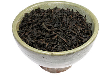 Ceylon Black Tea in a vintage earthenware bowl isolated on white background