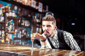 Bartender concocts a cocktail on the beerhall