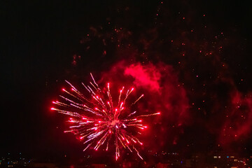 Festive colorful fireworks in the night sky, abstract background