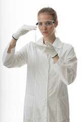 The girl laboratory assistant shows an indicator tube with the result of the analysis. Laboratory assistant in a medical laboratory or a petroleum product quality laboratory