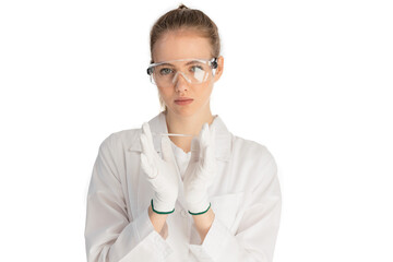 The girl laboratory assistant shows an indicator tube with the result of the analysis. Laboratory assistant in a medical laboratory or a petroleum product quality laboratory