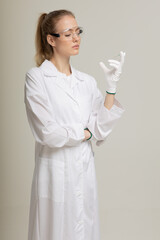 Covid19, coronavirus, healthcare and doctors concept. Portrait of optimistic russian female doctor assure everything be okay, wear medical mask to prevent catching virus, white coat.