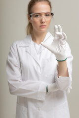 Covid19, coronavirus, healthcare and doctors concept. Portrait of optimistic russian female doctor assure everything be okay, wear medical mask to prevent catching virus, white coat.