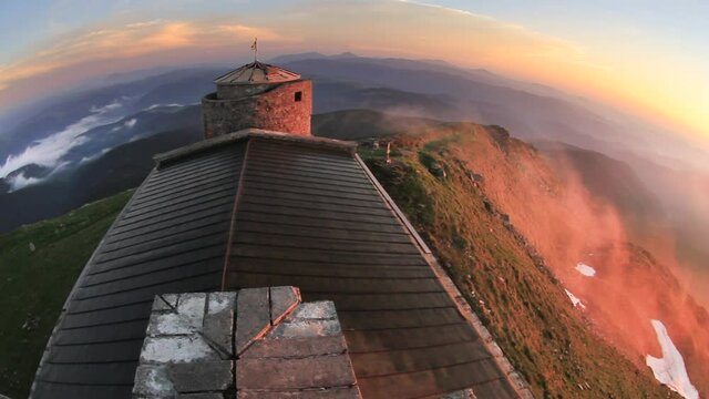 On the main ridge of the Carpathians - Montenegro is an ancient stone observatory Pop Ivan, built before WW2. Looks like a fortress or castle bastion, now planned reconstruction. wind blows the clouds