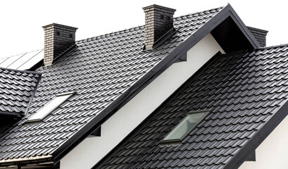 Roof of a new home. Ceramic chimney, metal roof tiles, gutters, roof window. TV antennas attached to the chimney. Single family house. - obrazy, fototapety, plakaty