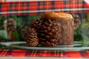 delicious panettone with pine cones on the side. Christmas decoration, close up photo.