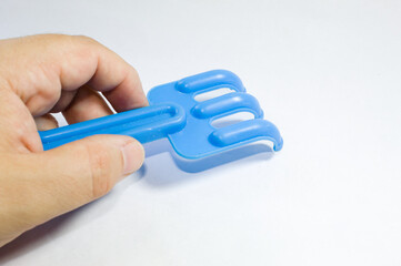 Toy rastel made of blue plastic
