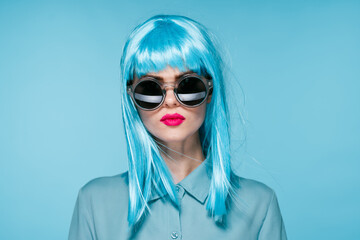 attractive woman in purple wig red glasses posing close-up
