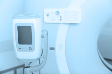 Fototapeta na wymiar Medical CT or MRI Scan in the modern hospital laboratory. Interior of radiography department. Technologically advanced equipment in white room. Magnetic resonance diagnostics machine