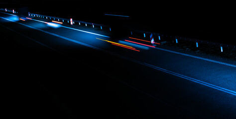 lights of moving cars at night. long exposure