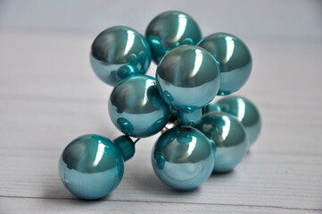 Toys for the Christmas tree. Christmas turquoise balls on the table.