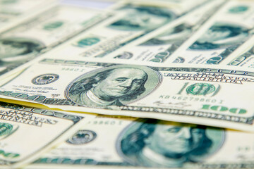 US Dollar banknotes background. American money as symbol of wealth and success. Selective focus.