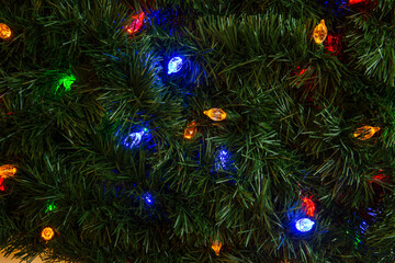 Obraz na płótnie Canvas Christmas garland with multi colored lights background with copy space