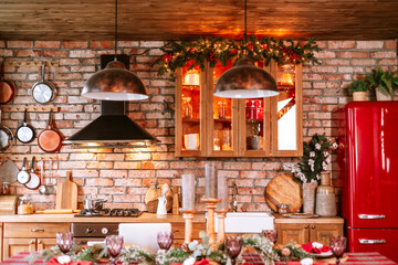 Christmas set table in living room and kitchen chalet ready for Christmas or New Year's festive dinner