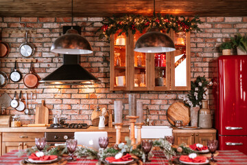 Christmas set table in living room and kitchen chalet ready for Christmas or New Year's festive dinner