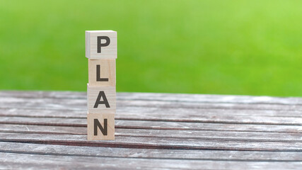 wooden cube with word plan. business planning concept